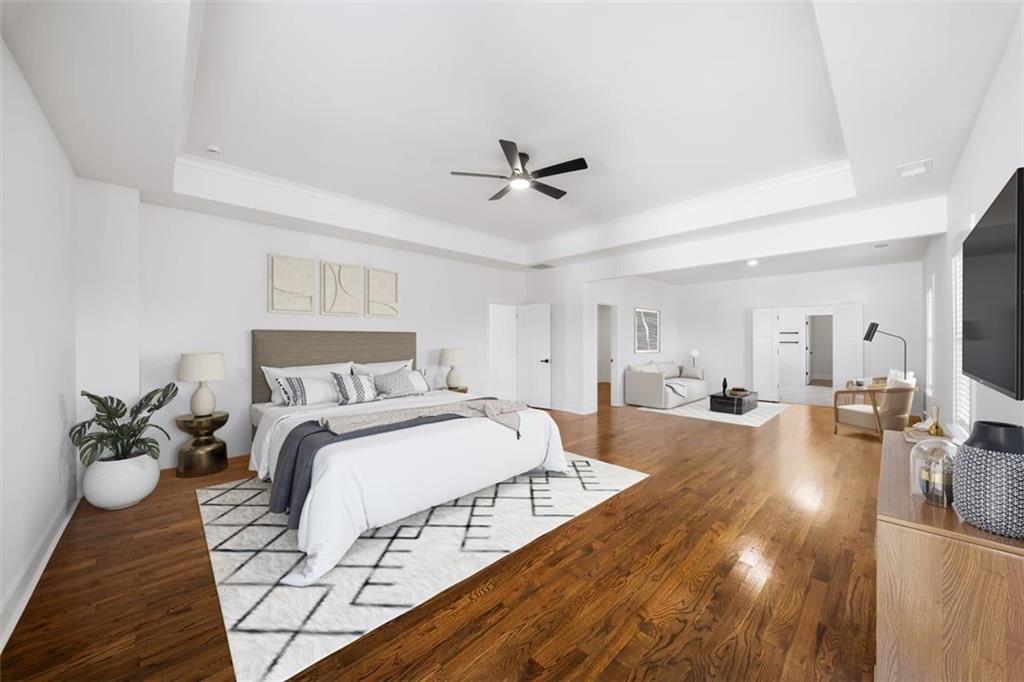 222 Silvercrest Drive Acworth, GA 30101 - Photo 27 of 61 a spacious bedroom with a bed and wooden floor