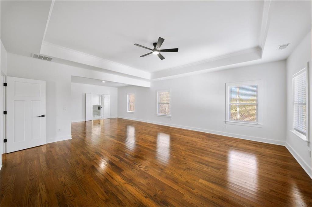 222 Silvercrest Drive Acworth, GA 30101 - Photo 28 of 61 a view of empty room with wooden floor and fan