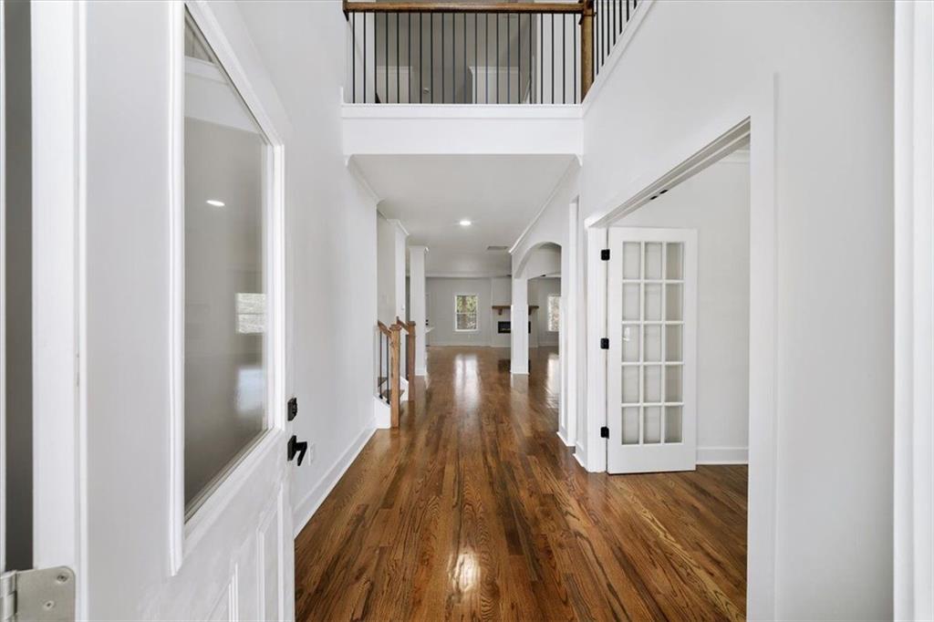 222 Silvercrest Drive Acworth, GA 30101 - Photo 30 of 61 a view of a hallway with wooden floor and staircase