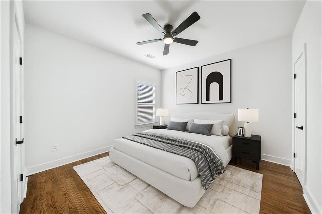 222 Silvercrest Drive Acworth, GA 30101 - Photo 34 of 61 a bedroom with a large bed and a ceiling fan