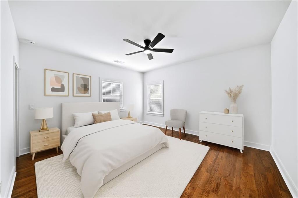 222 Silvercrest Drive Acworth, GA 30101 - Photo 41 of 73 a bedroom with a bed and a chandelier