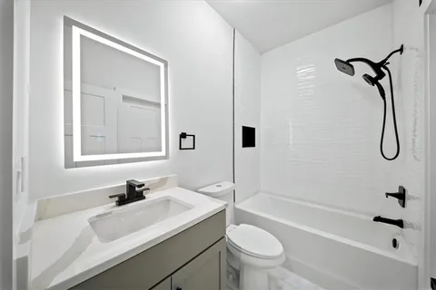 an outdoor view of a house with sitting area