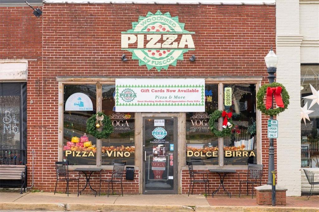 222 Silvercrest Drive Acworth, GA 30101 - Photo 50 of 61 a front view of a building with retail shops