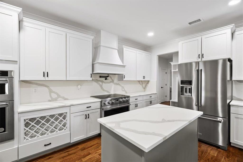 222 Silvercrest Drive Acworth, GA 30101 - Photo 6 of 61 a kitchen with a white stove top oven and refrigerator