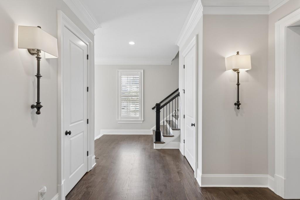 3585 Roxboro Road Northeast, Unit 6 Atlanta, GA 30326 - Photo 11 of 51 a view of a hallway with wooden floor and stairs