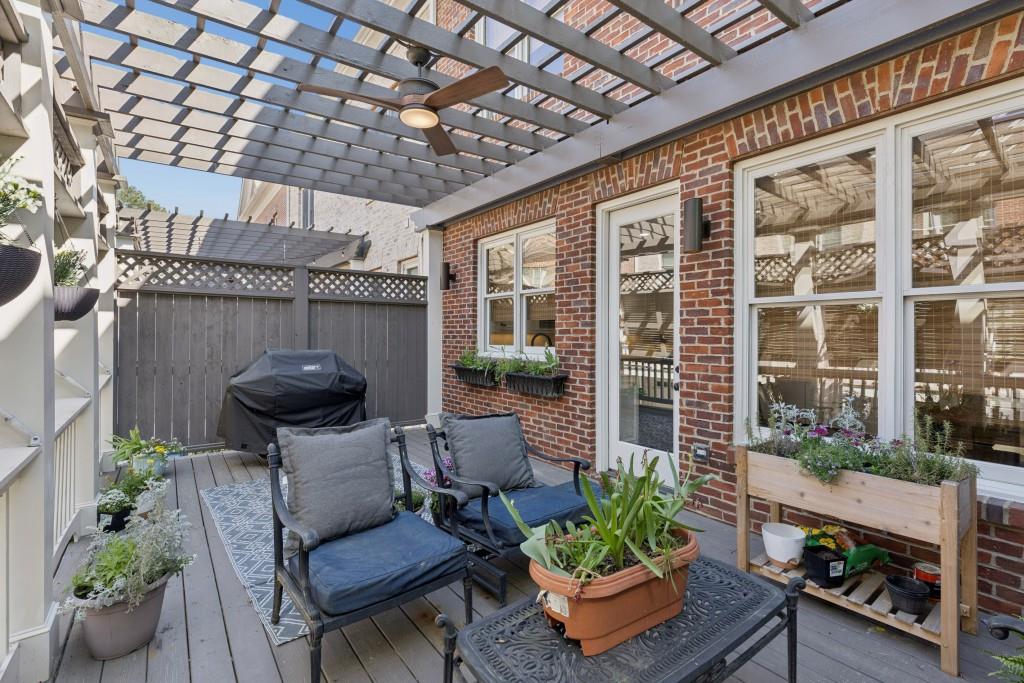 3585 Roxboro Road Northeast, Unit 6 Atlanta, GA 30326 - Photo 21 of 51 a view of a porch with chairs and a potted plant