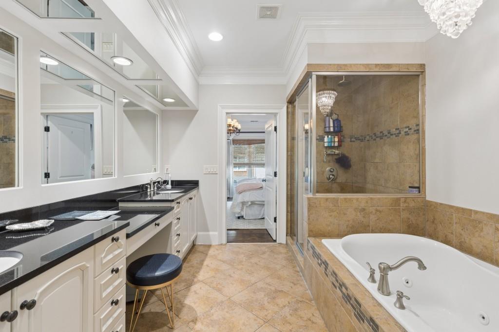 3585 Roxboro Road Northeast, Unit 6 Atlanta, GA 30326 - Photo 29 of 51 a bathroom with a bathtub and a sink