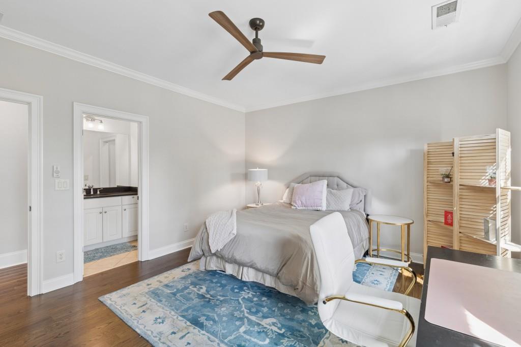 3585 Roxboro Road Northeast, Unit 6 Atlanta, GA 30326 - Photo 35 of 51 a bedroom with a bed and a table