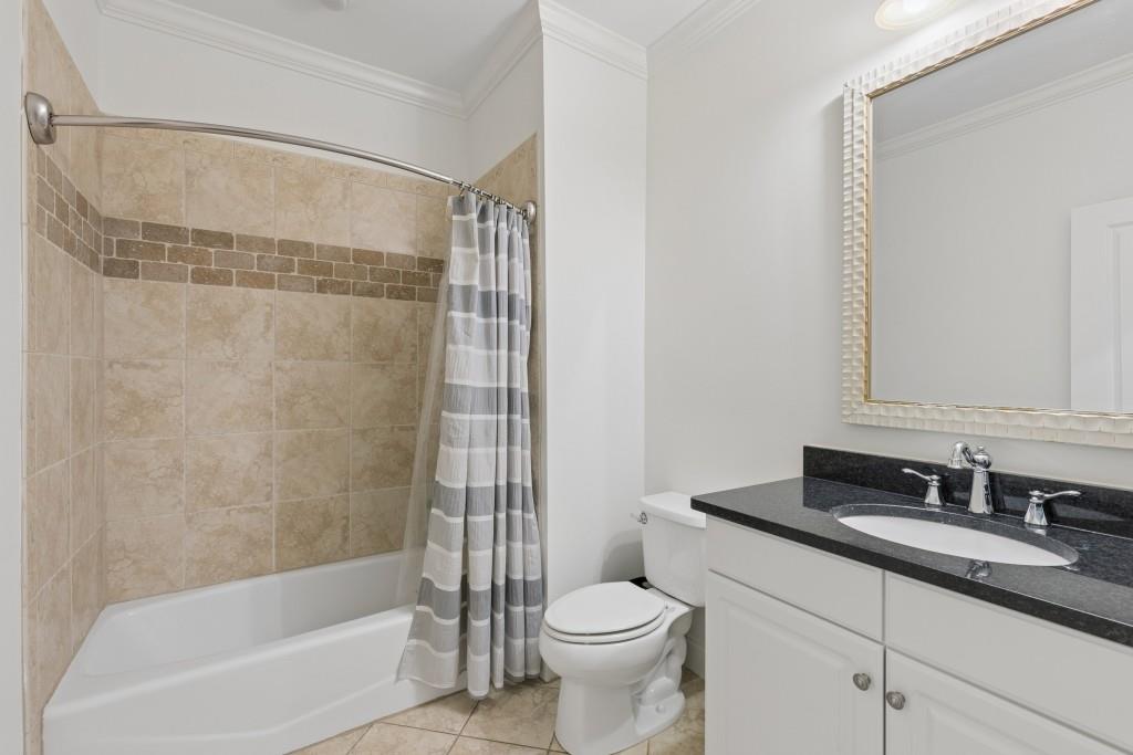 3585 Roxboro Road Northeast, Unit 6 Atlanta, GA 30326 - Photo 43 of 51 a bathroom with a granite countertop sink toilet and shower
