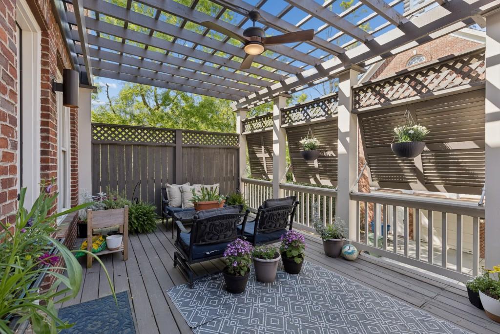 3585 Roxboro Road Northeast, Unit 6 Atlanta, GA 30326 - Photo 5 of 51 a view of a patio with a table and chairs