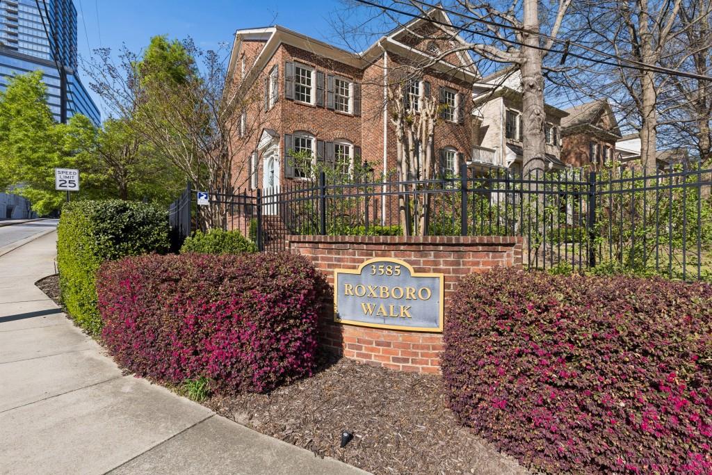 3585 Roxboro Road Northeast, Unit 6 Atlanta, GA 30326 - Photo 6 of 51 a sign on the side of a road