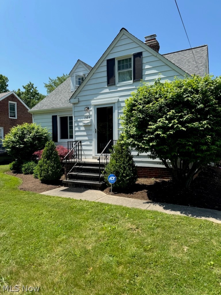 1584 Edgefield Road Lyndhurst, OH 44124 - Photo 1 of 1 View of front of house featuring a front lawn