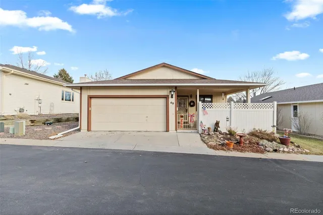 a front view of a house with basket ball court and outdoor view