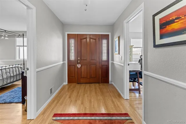 a room that has a rug and a wooden floor