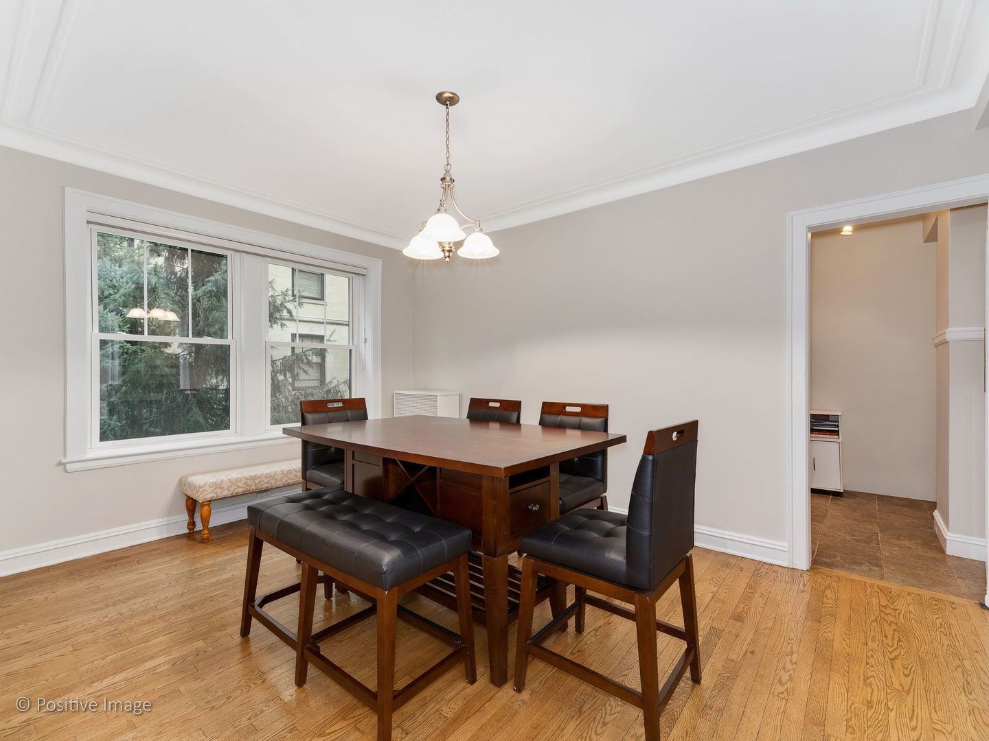 3608 North Pine Grove Avenue, Unit 1M Chicago, IL 60613 - Photo 11 of 24 a dining room with furniture and window
