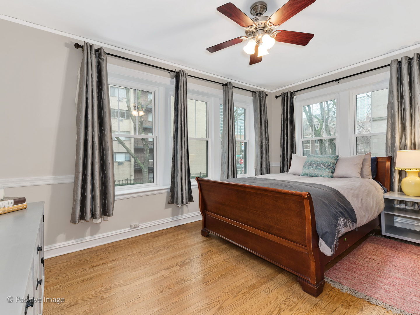 3608 North Pine Grove Avenue, Unit 1M Chicago, IL 60613 - Photo 17 of 24 a bed sitting in a spacious bedroom next to a window