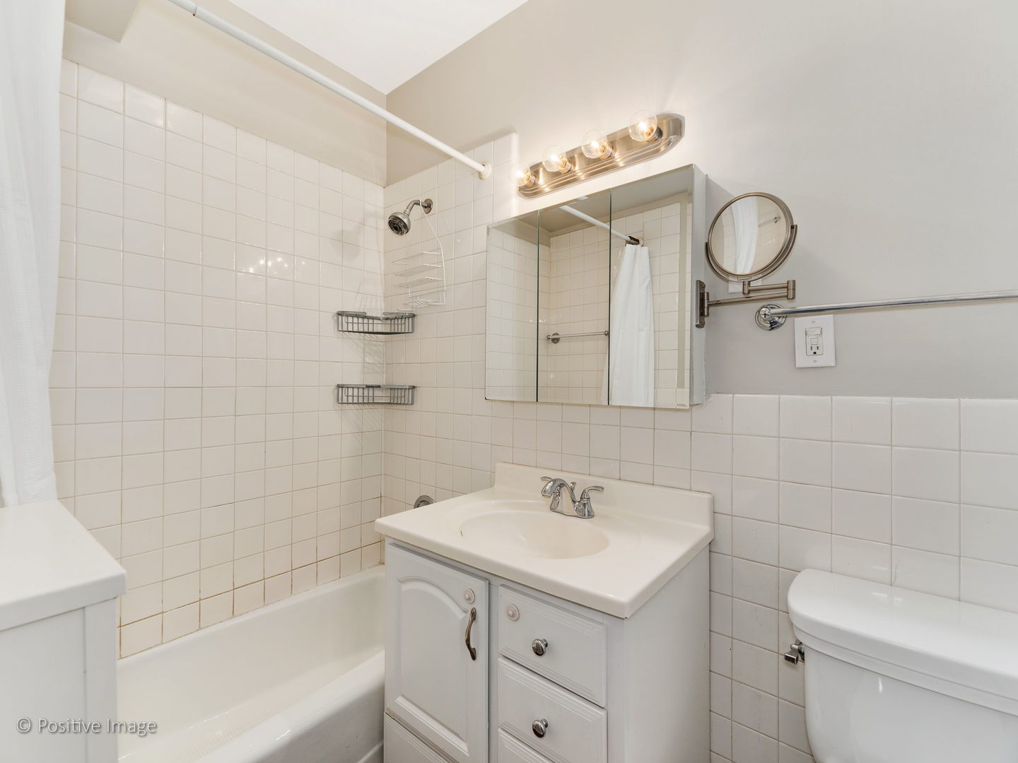 3608 North Pine Grove Avenue, Unit 1M Chicago, IL 60613 - Photo 20 of 24 a bathroom with a sink a toilet and shower