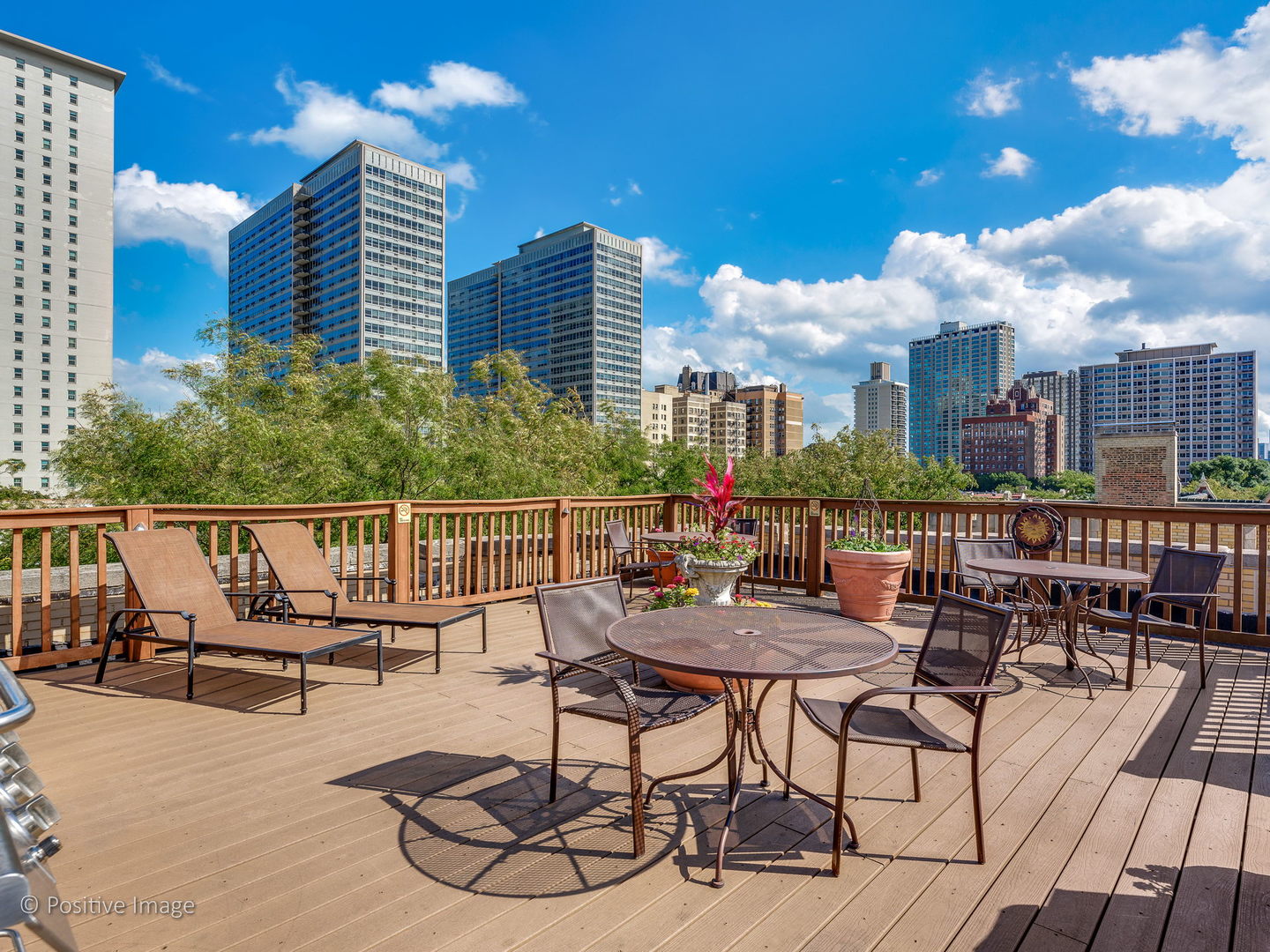 3608 North Pine Grove Avenue, Unit 1M Chicago, IL 60613 - Photo 21 of 24 a view of a balcony with chairs and tables