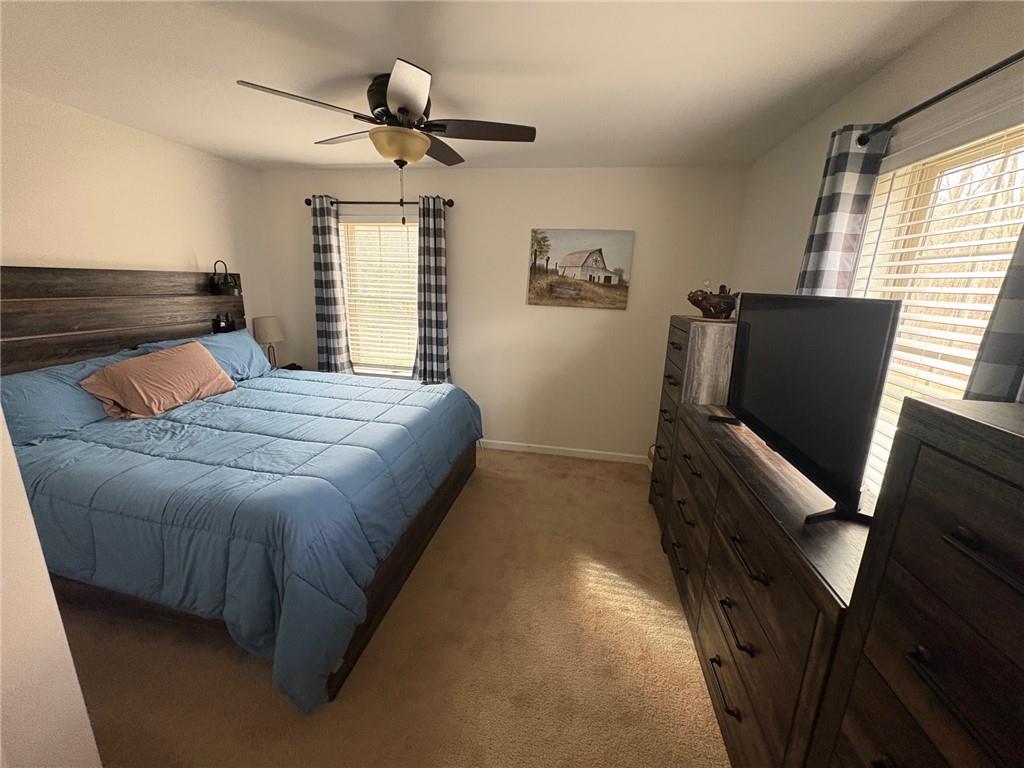 382 Hosack Road Jackson Center, PA 16133 - Photo 12 of 27 a bedroom with a bed and wooden floor