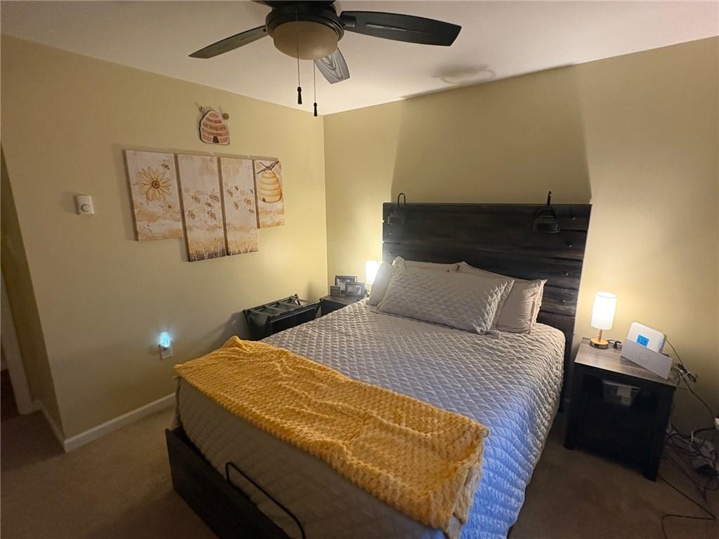 382 Hosack Road Jackson Center, PA 16133 - Photo 13 of 27 a bedroom with a bed and a lamp