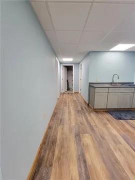 382 Hosack Road Jackson Center, PA 16133 - Photo 16 of 27 a view of a livingroom with wooden floor and kitchen space