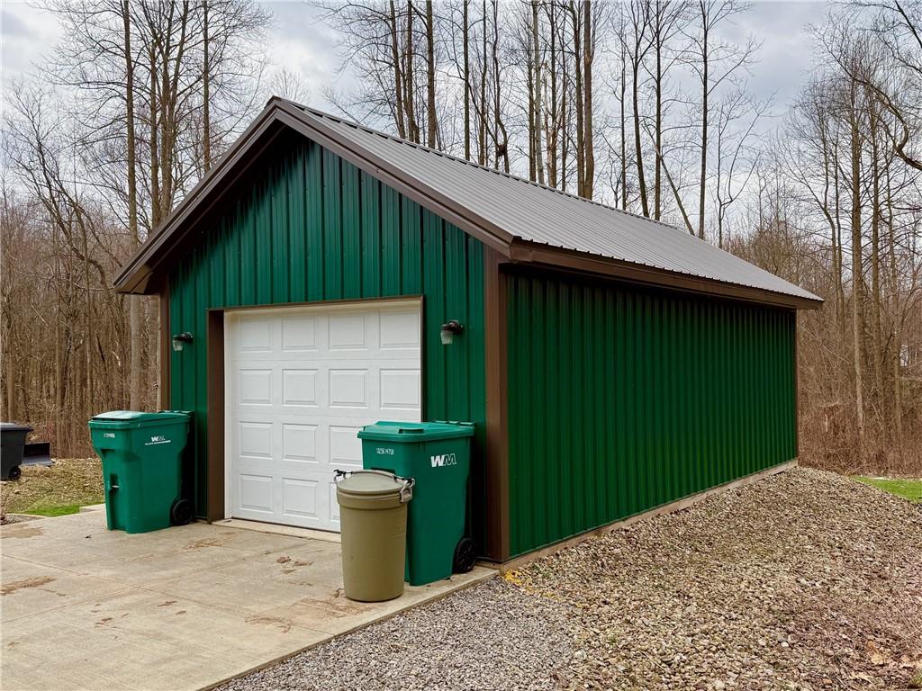 382 Hosack Road Jackson Center, PA 16133 - Photo 19 of 27 a front view of a house with a garden