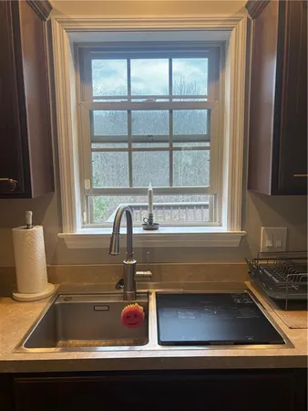 a kitchen with a sink and a window