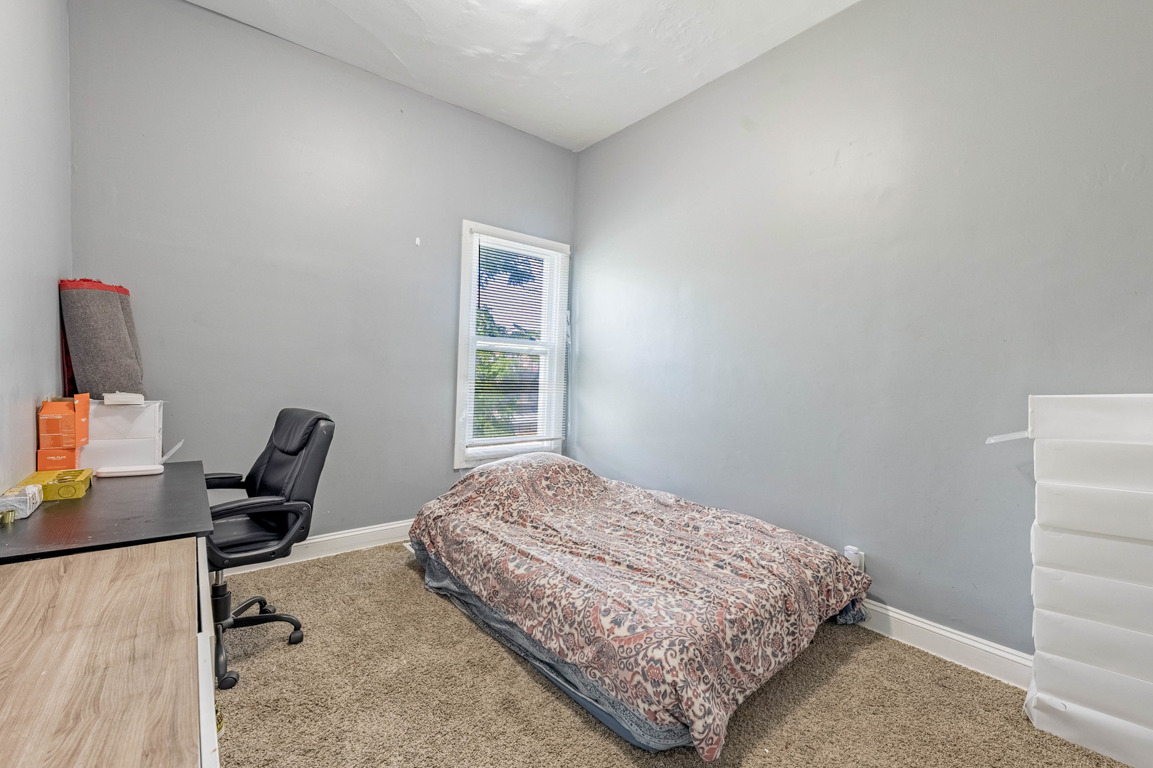 1908 South Sawyer Avenue Chicago, IL 60623 - Photo 17 of 31 a bedroom with a bed a desk and chair