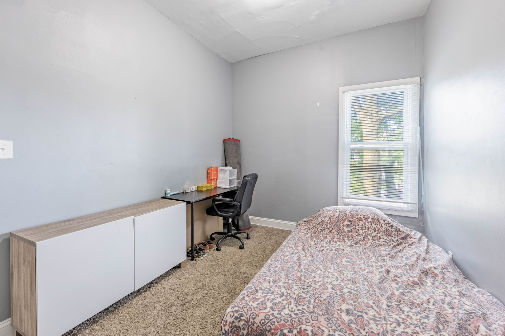 1908 South Sawyer Avenue Chicago, IL 60623 - Photo 18 of 31 a view of a workspace with furniture and a window