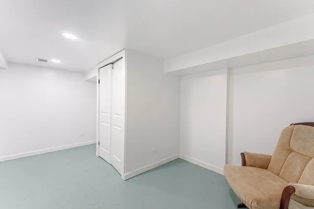 a view of room with furniture and wooden floor