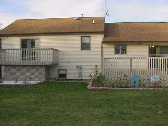 2773 Graham Road Belvidere, IL 61008 - Photo 5 of 6 a brick house with garden in front of it