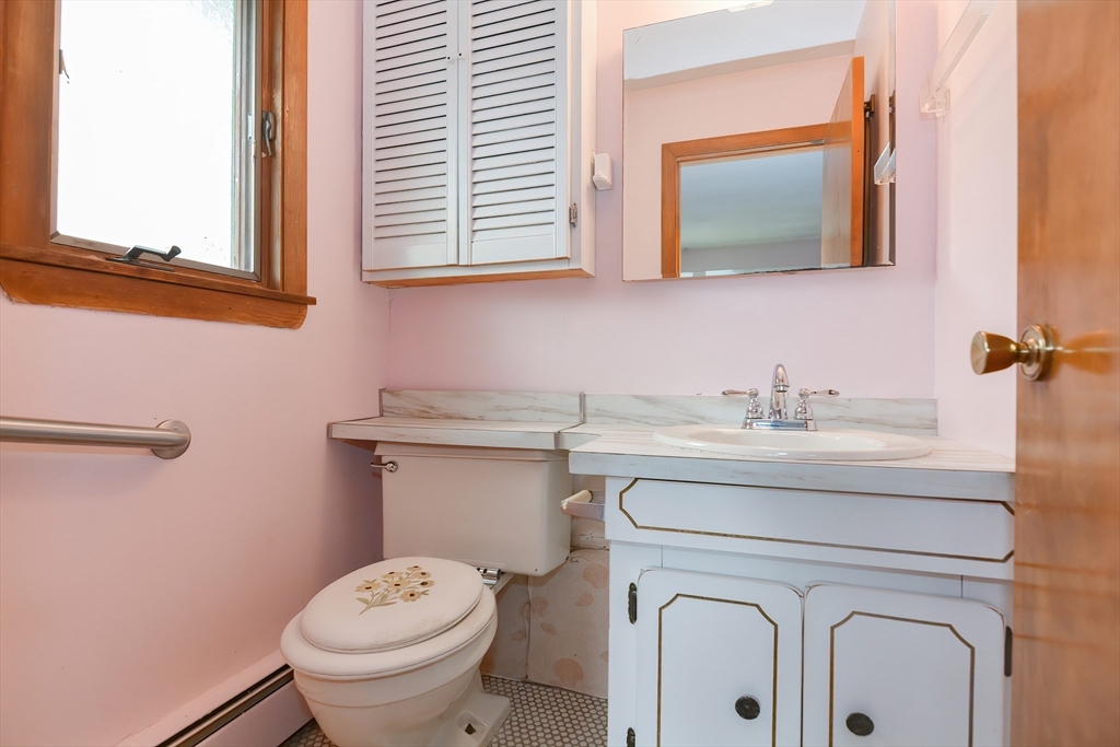 12 Catherine Road Framingham, MA 01701 - Photo 27 of 40 a bathroom with a toilet sink and mirror