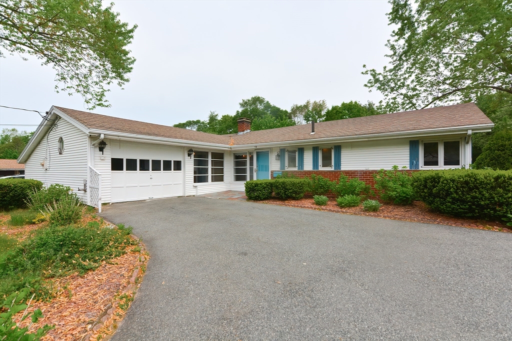 12 Catherine Road Framingham, MA 01701 - Photo 3 of 40 a view of a house with a yard and potted plants