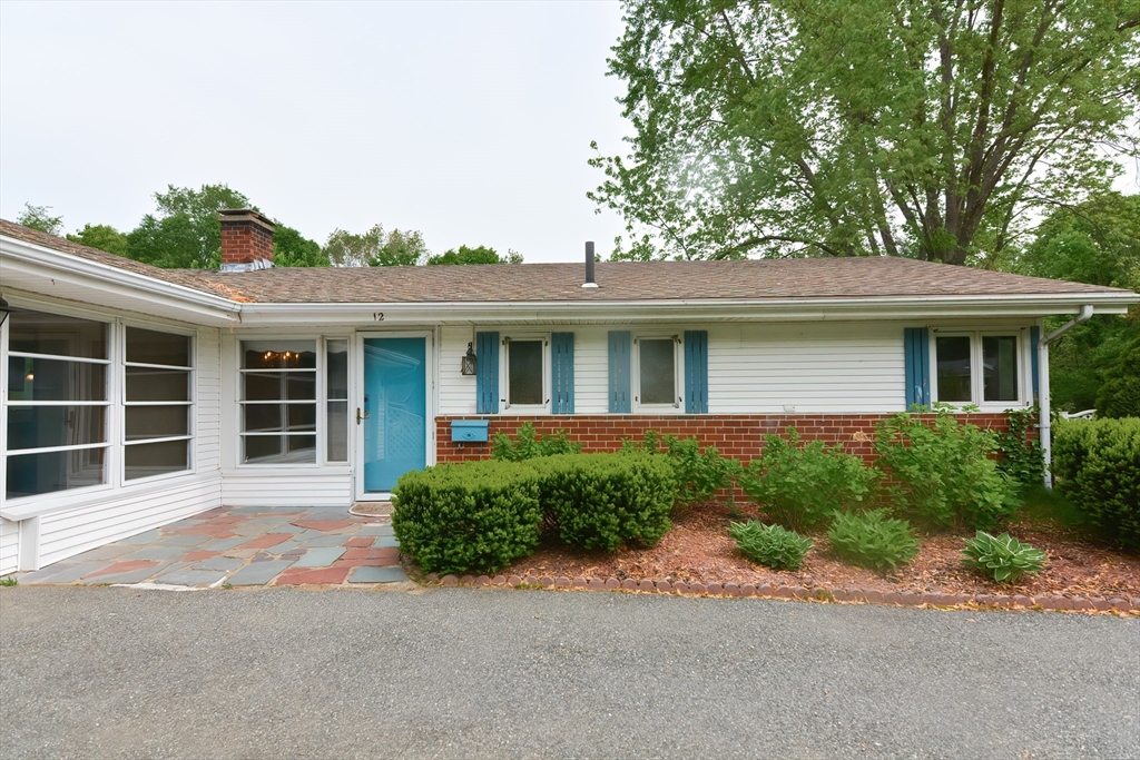 12 Catherine Road Framingham, MA 01701 - Photo 4 of 40 a front view of a house with a yard and garage