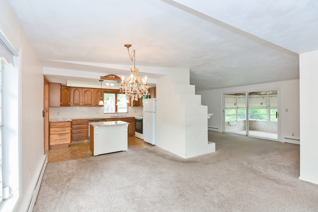 12 Catherine Road Framingham, MA 01701 - Photo 6 of 40 a view of kitchen and hall with wooden floor