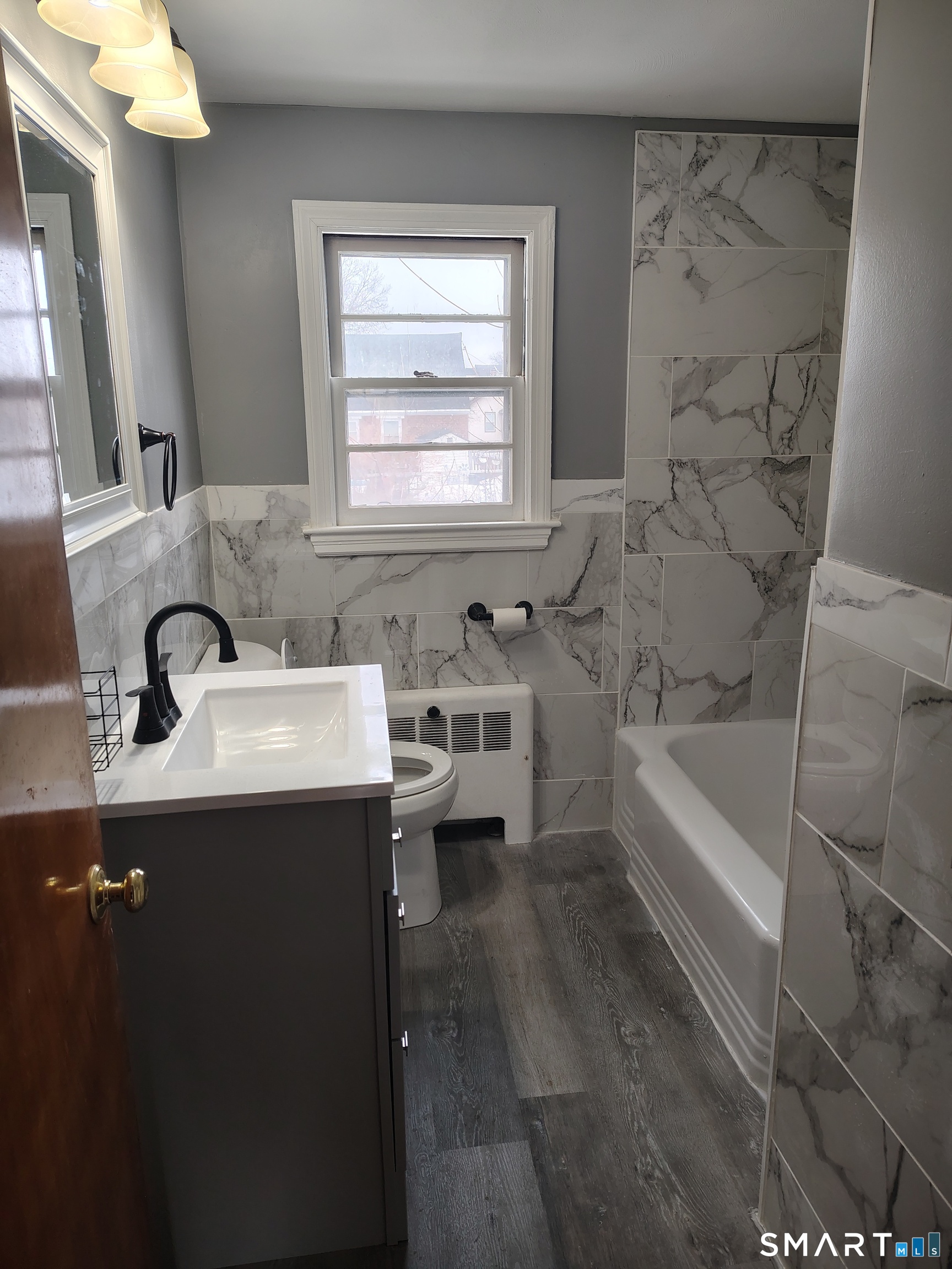 166 George Street Hartford, CT 06114 - Photo 4 of 29 a bathroom with a sink and a bathtub