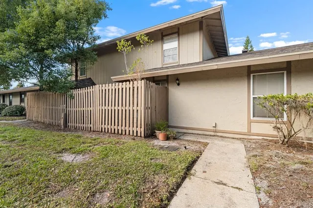 a side view of a house with a garage