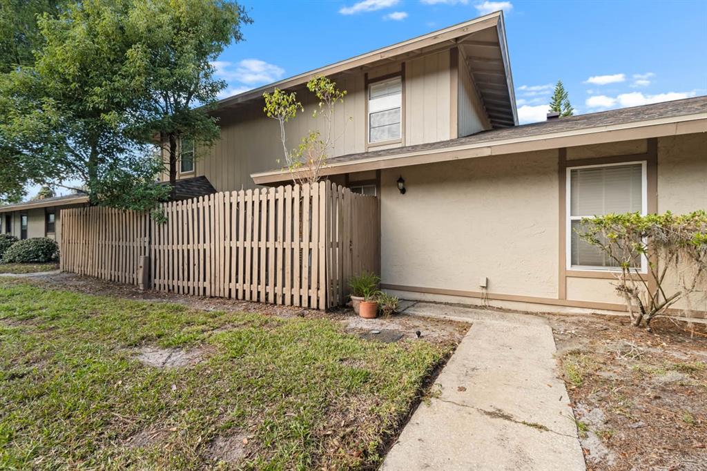 a side view of a house with a garage
