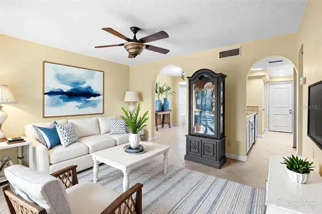 a living room with furniture and a large window