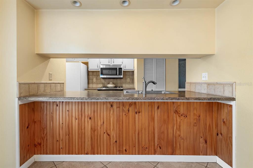 903 Buck Court Brandon, FL 33511 - Photo 14 of 24 a view of kitchen with stainless steel appliances wooden floor