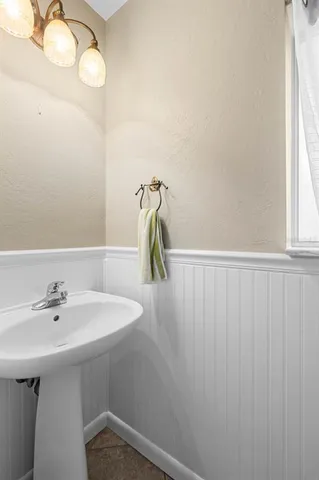 a bathroom with a sink and mirror