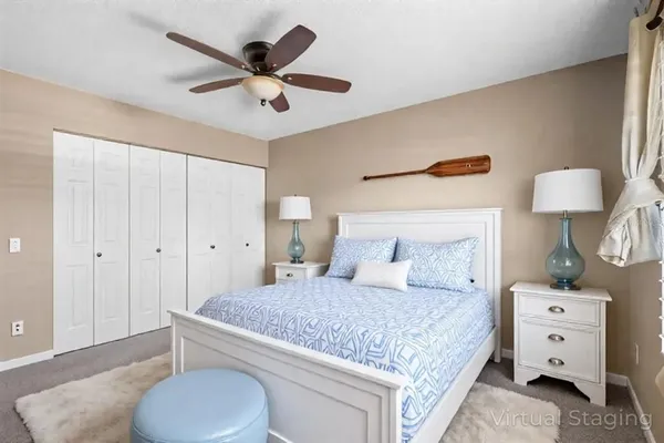 a bedroom with a bed and a dresser