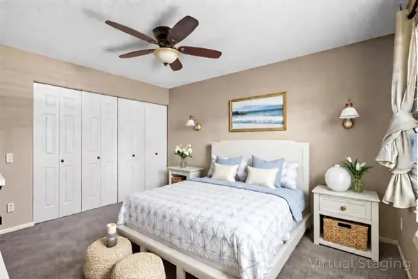 a bedroom with a bed and window