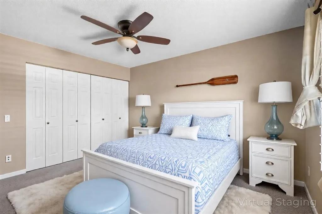 903 Buck Court Brandon, FL 33511 - Photo 21 of 24 a bedroom with a bed and a dresser