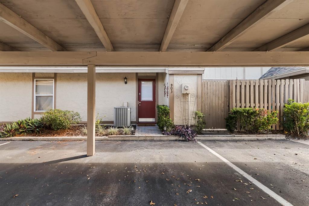 903 Buck Court Brandon, FL 33511 - Photo 4 of 24 a row of palm trees in front of a building