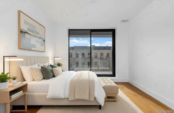 a bedroom with a bed and window