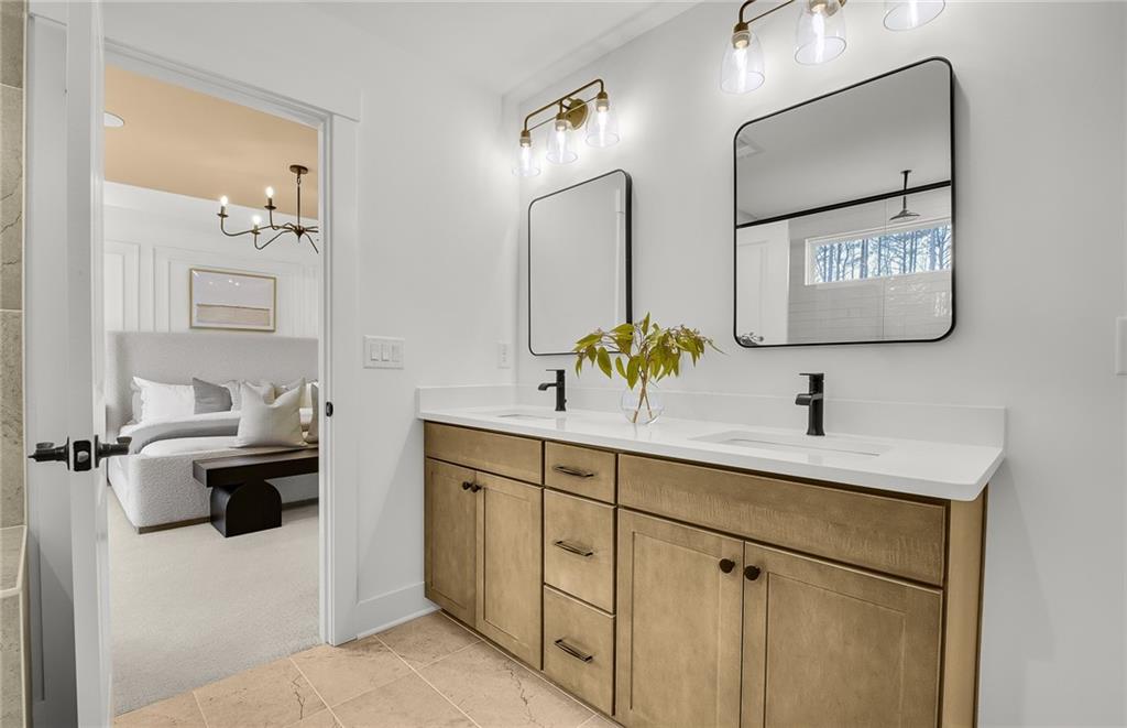 5375 Julep Court Cumming, GA 30028 - Photo 16 of 22 a bathroom with a sink and a mirror