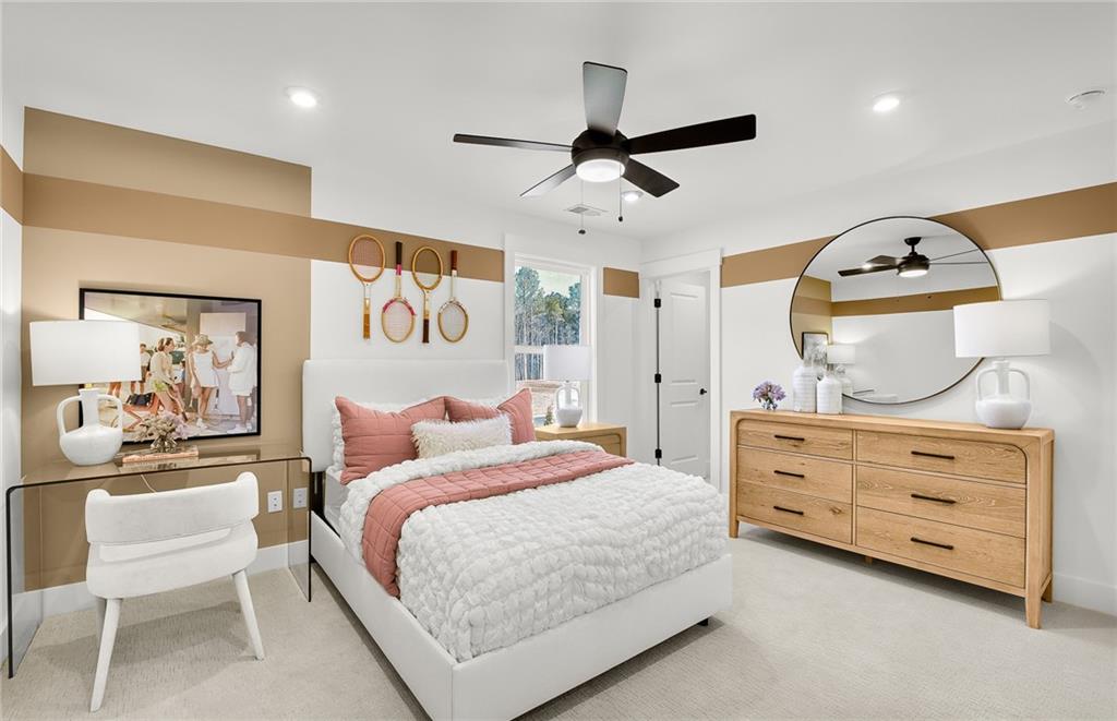 5375 Julep Court Cumming, GA 30028 - Photo 18 of 22 a bedroom with a bed and cabinets