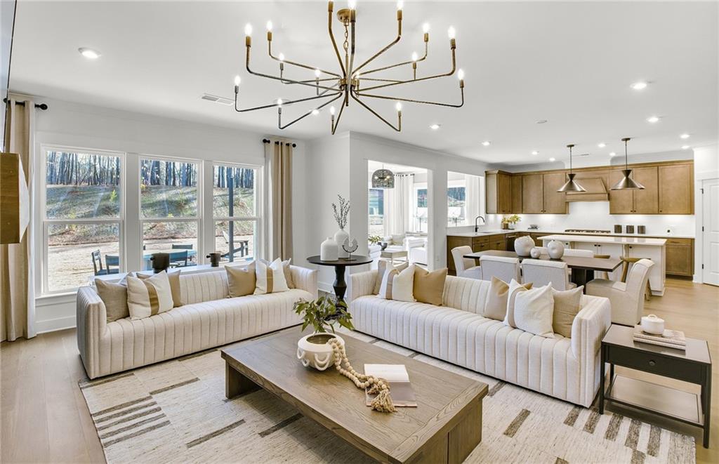 5375 Julep Court Cumming, GA 30028 - Photo 2 of 22 a living room with furniture fireplace and a large window