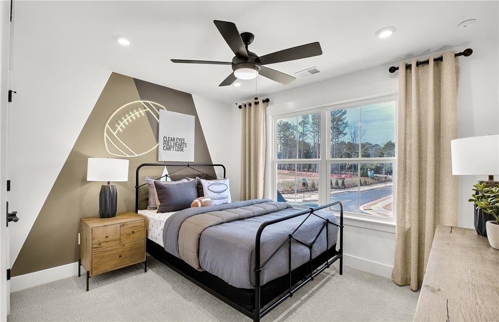 5375 Julep Court Cumming, GA 30028 - Photo 22 of 22 a bedroom with a bed and a large window